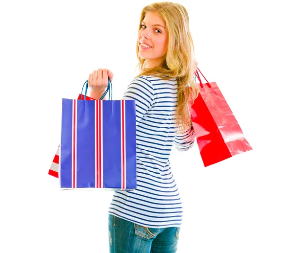 Lachende tiener meisje met shopping tassen — Stockfoto