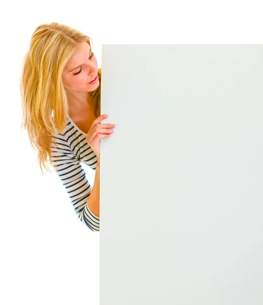 Portrait of teen girl looking on blank billboard — Stock Photo, Image