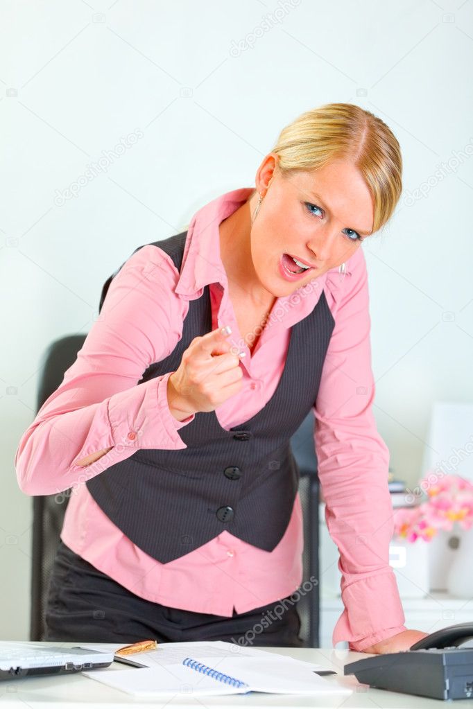Angry business woman shaking finger