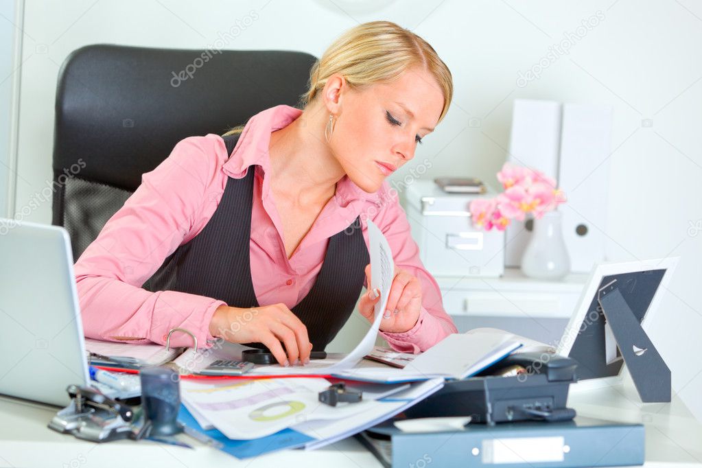 Hard working on documents modern business woman