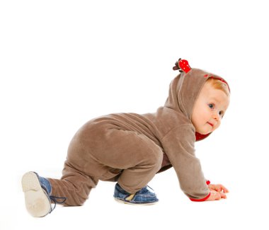 Curious baby in costume of Santa Claues reindeer crawling clipart