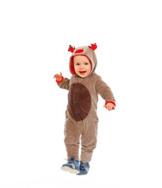 Happy baby in costume of Santa Claus's reindeer making step clipart