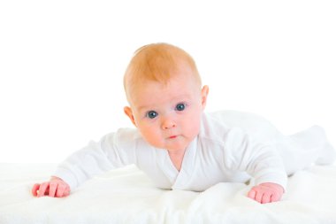 Cute four month old baby laying on abdomen on diaper clipart