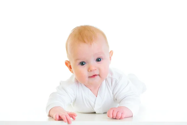 Smiling four month old baby laying on abdomen — Stock Photo, Image