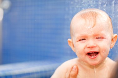 Lovely baby taking shower clipart