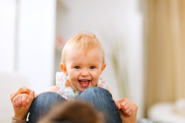 Portrait of smiling playing baby clipart