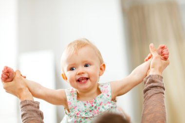 Portrait of happy playing baby clipart