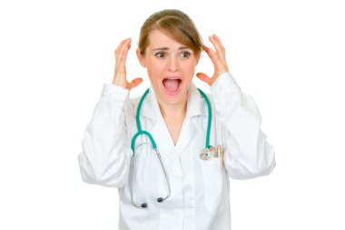 Shocked medical female doctor holding her hands near head clipart