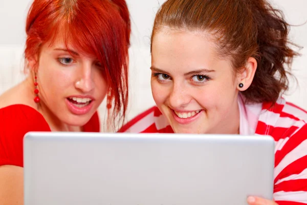 Funny girlfriends using laptop. Closeup — Stock Photo, Image