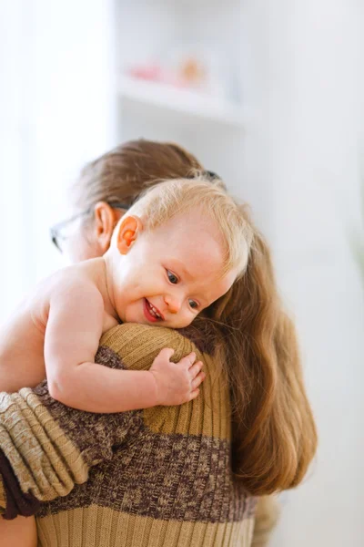 Little cute baby hanging mama — Stock Photo, Image