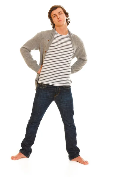 Ritratto a figura intera di giovane in jeans e maglione su bianco — Foto Stock