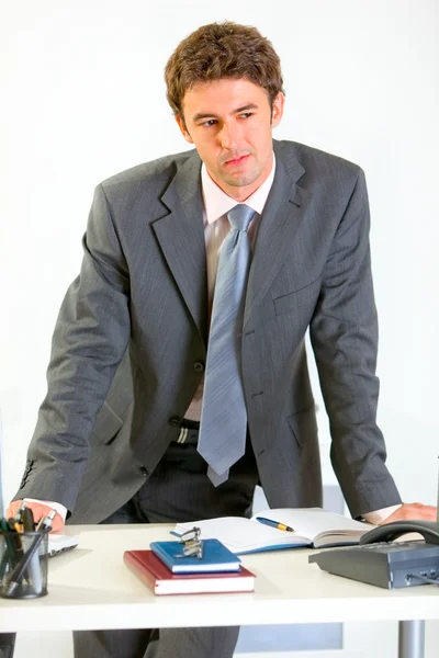 Portret van doordachte moderne zakenman hand in hand op kantoor — Stockfoto