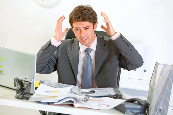 Confused modern businessman lost in documents — Stock Photo, Image