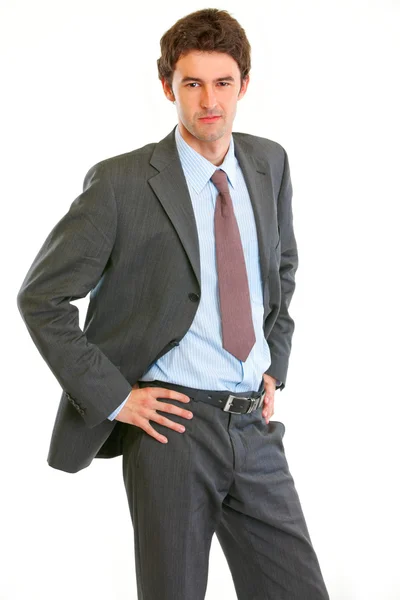 Angry modern businessman with hand on hips — Stock Photo, Image