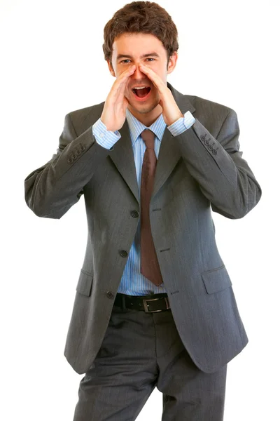 Vrolijke moderne zakenman schreeuwen door megafoon vormige handen — Stockfoto