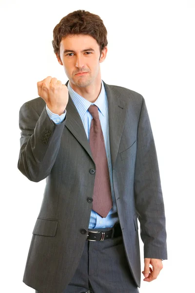 Злой современный бизнесмен угрожает кулаком — стоковое фото