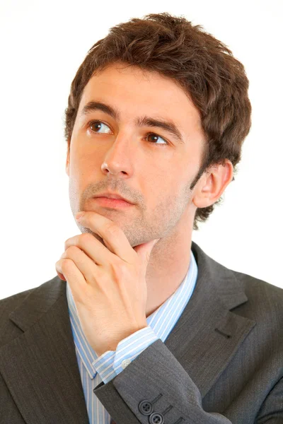 Portrait of serious modern businessman looking in corner at copy space — Stock Photo, Image
