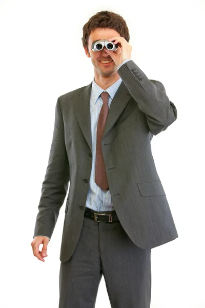 Modern businessman looking in binoculars — Stock Photo, Image