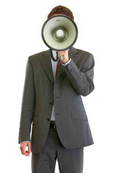 Modern businessman holding megaphone in front of face