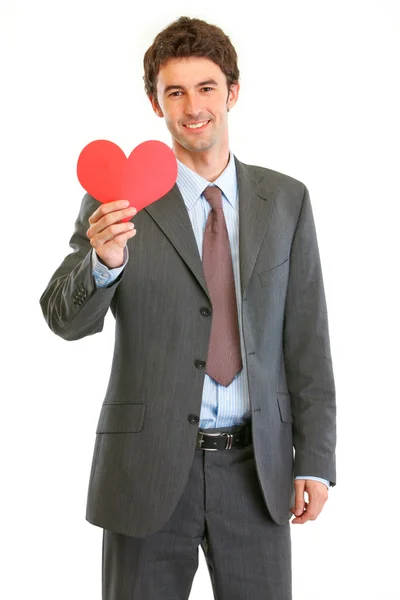 Empresário moderno sorridente com o coração de Valentin na mão — Fotografia de Stock