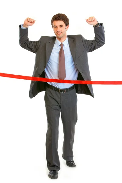 Full length portrait of pleased businessman crossing finish line — Stock Photo, Image