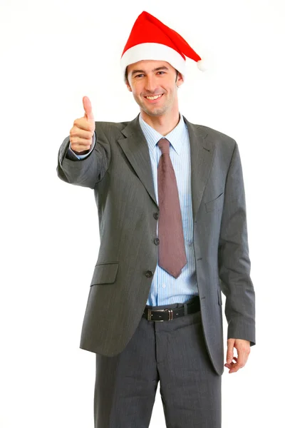 Sonriente hombre de negocios moderno en Santa Sombrero mostrando pulgares hacia arriba —  Fotos de Stock