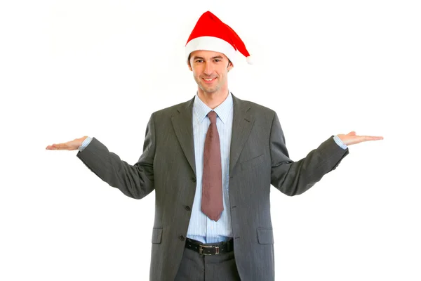 Gülümseyen modern iş adamı Noel Baba şapkası — Stok fotoğraf