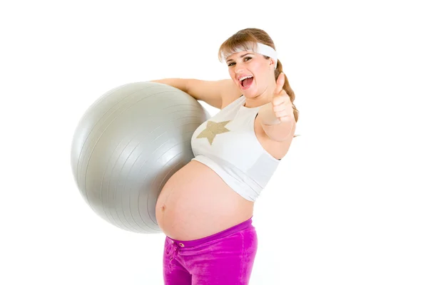Schwangere macht Pilates-Übungen auf grauem Ball — Stockfoto