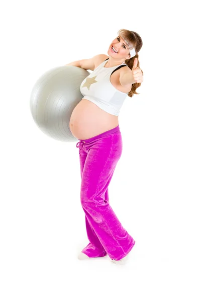 Femme enceinte faisant des exercices pilates sur balle grise — Photo