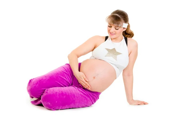 Gülümseyen güzel hamile kadın egzersiz sonra rahatlatıcı — Stok fotoğraf