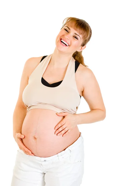 Gelukkig mooie zwangere vrouw aan haar buik op wit wordt geïsoleerd te raken — Stockfoto