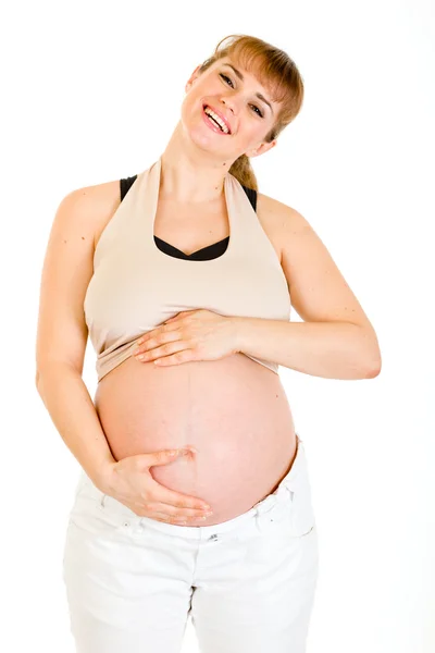 Gelukkig mooie zwangere vrouw aan haar buik op wit wordt geïsoleerd te raken — Stockfoto