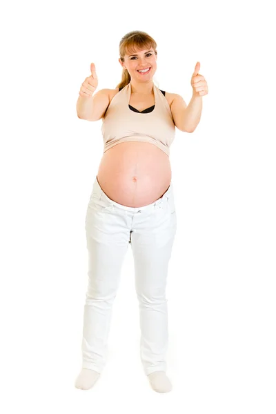 Sonriendo mujer embarazada mostrando los pulgares hacia arriba gesto — Foto de Stock