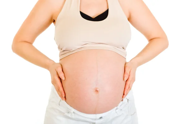 Trzymając jej brzuch kobiety w ciąży. szczelnie-do góry. — Zdjęcie stockowe