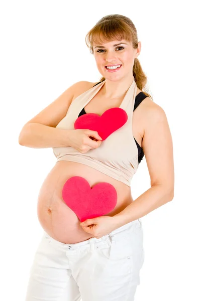 Mutlu hamile kadın iki kağıt kalp elinde tutan. kavram - iki kalp — Stok fotoğraf