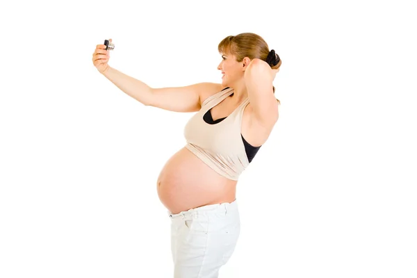 Glad gravid kvinna fotografering själv — Stockfoto