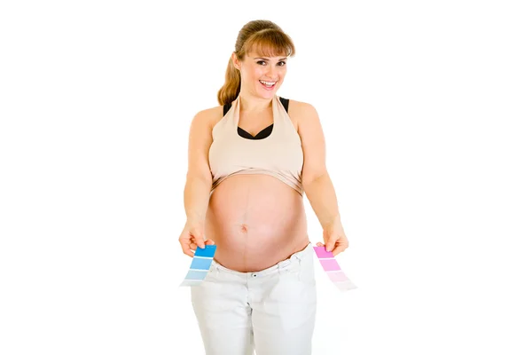 Glückliche schwangere Frau mit Farbmustern — Stockfoto