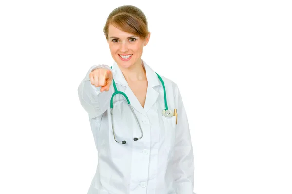 Smiling medical female doctor pointing finger at you — Stock fotografie