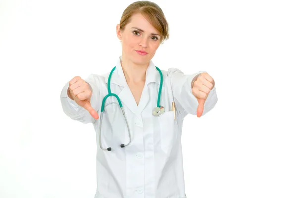 Kobieta niezadowolony lekarz pokazano kciuk w dół gest — Zdjęcie stockowe