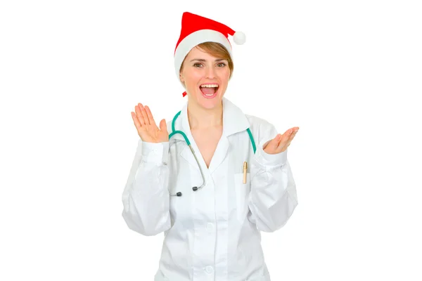 Szczęśliwa kobieta lekarz w santa hat klaskanie ręce — Zdjęcie stockowe