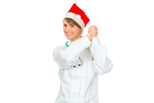 パートナーシップのジェスチャーを示すサンタ帽子の女性医師の笑みを浮かべてください。 — ストック写真