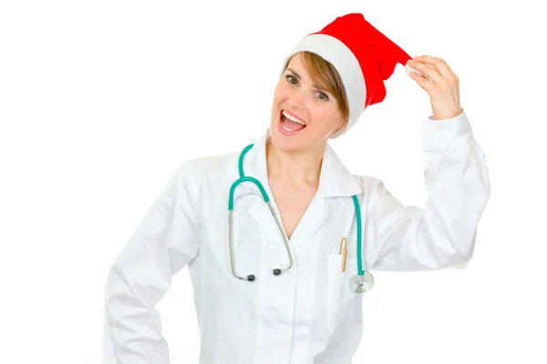 Happy medical doctor woman in Santa hat holding pompom — Stock Photo, Image