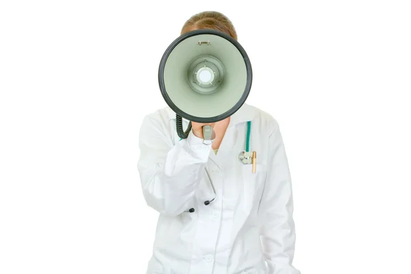 Medical doctor woman standing in front of camera and speaking into megapho — Stock Photo, Image