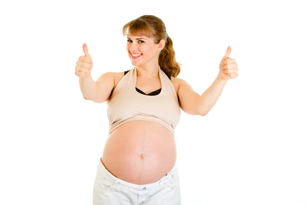 Šťastné těhotná žena ukazuje palec nahoru gesto — Stock fotografie