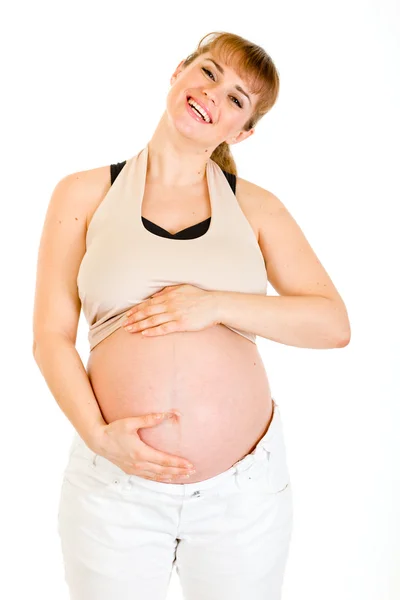 Happy beautiful pregnant woman touching her belly isolated on white Stock Image