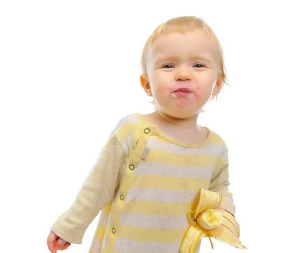 Retrato de bebé lindo comiendo plátano aislado en blanco — Foto de Stock