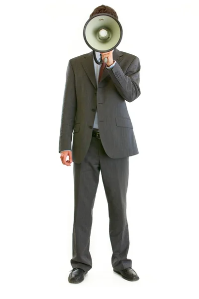 Hombre de negocios moderno sosteniendo megáfono en la parte delantera de la cara — Foto de Stock