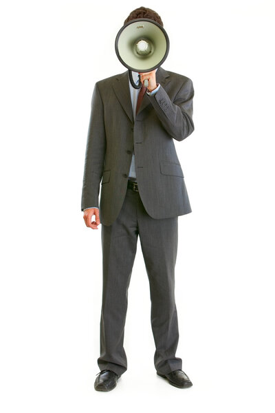 Modern businessman holding megaphone in the front of face