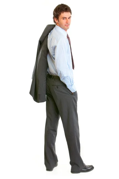 Full length portrait of smiling modern businessman looking back — Stock Photo, Image