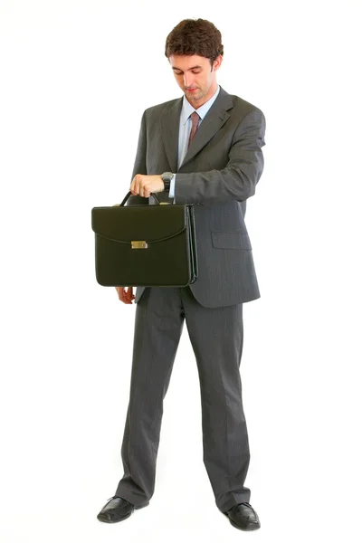 Full length portrait of modern businessman with suitcase looking — Stock Photo, Image